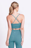 Criss-cross strap, medium impact, teal, crop sports bra. Sustainable and ethical.