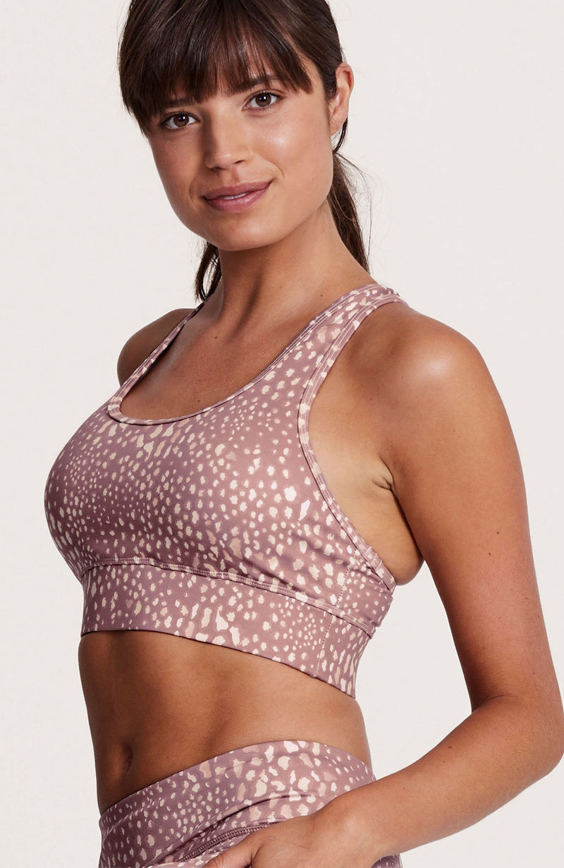 Racerback, mauve, pink and white, fuller coverage, removable padding, medium support. Sustainable and ethical.